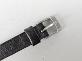 black leather belt with silver buckle on a white surface