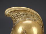 an image of a golden helmet on a black background
