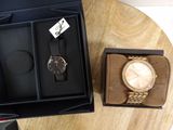 two watches in the box on the table