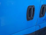 a close up of a blue van with two round windows
