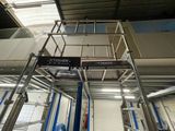 a picture of a lift in a building with a sign on it