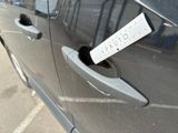 a sticker on the door handle of a car