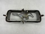silver metal horse belt buckle on a white background