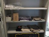 a closet with many items in it and a hard hat on the floor