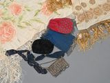 several pieces of clothing and accessories are laid out on a bed