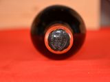 a bottle of wine that is sitting on a table