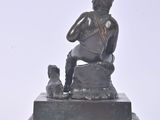 a statue of a man with a dog on a pedestal