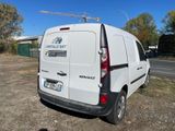 a white van that is parked on the side of the road