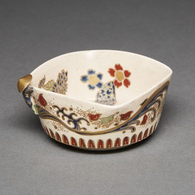 an image of a small bowl with a flower design on it