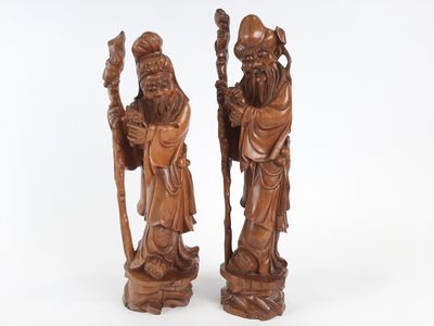 pair of chinese carved wood figures of a man and a woman