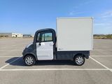 an image of a small white truck parked in a parking lot