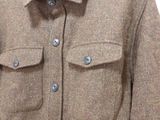 a picture of a jacket hanging on a hanger