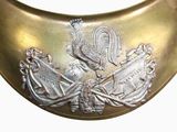a gold collar with a rooster on it on a white background