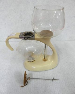 a glass with a wooden handle and a glass with a glass in it