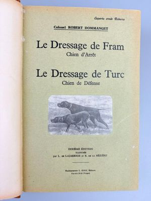 an open book with a picture of a dog and a cat on it