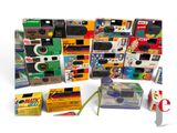 many different types of cameras and other items on the table