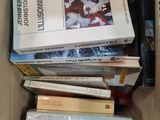 a box full of books sitting on top of each other