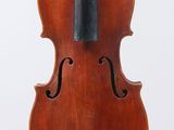 an old violin with a bow hanging from it ' s back