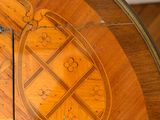 an image of a wooden table with a clock on it