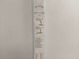 a tall piece of paper that has a drawing of a house on it