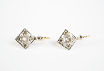 an image of a pair of diamond earrings on a white background
