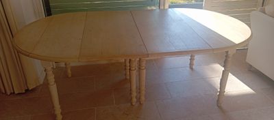 an image of a dining room table in front of a window