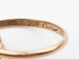 an image of a close up of a gold ring with a diamond