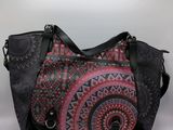 an image of a black and pink purse with a pattern on it