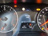 a close up of a car dashboard with a clock on it