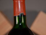 a bottle of wine that has been left on the table