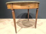 a small wooden table with a drawer on top of it