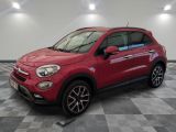 a red fiat suv parked on a checkered floor in a garage