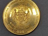 a gold coin with a coat of arms and a coat of arms on it