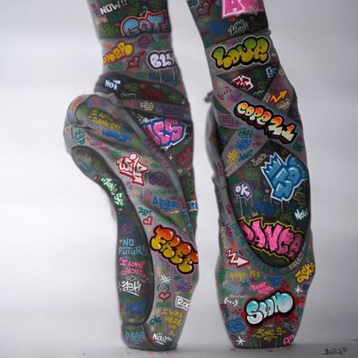 a close up of a person ' s feet with graffiti on them