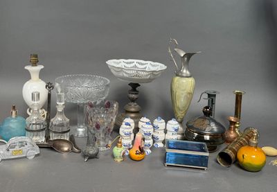 many different types of glass items displayed on the table