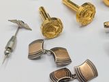 a lot of different types of cuff watches on a table