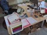 a desk with a computer and a monitor on it