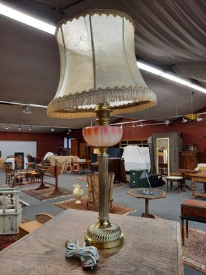 a lamp that is sitting on a table in a room