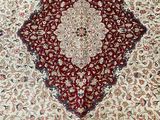 an image of a red and white rug with a diamond design