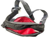 a black bag with a red pocket inside of it