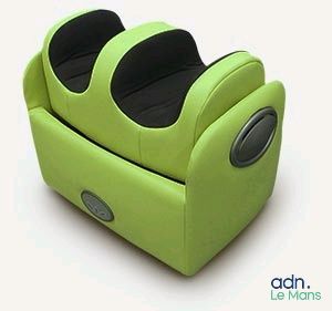 a green recliner that is sitting on a white surface