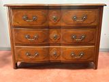 an image of a wooden dresser with many drawers on it