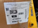 a cardboard box with a sticker on it sitting in front of a forklift