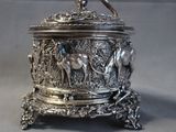 a silver box with a bird on top of it