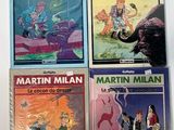 four children ' s books are lined up on a white surface