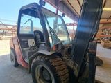 a forklift that is parked in a warehouse