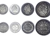 an image of a group of five different coins on a white background