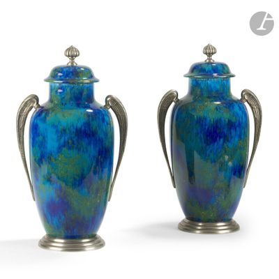 pair of blue vases with silver handles on a white background
