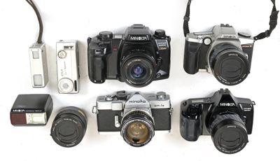 a lot of cameras that are lined up on the table