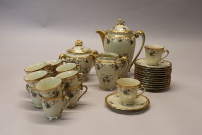 many cups and saucers that are sitting on a table